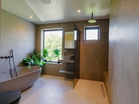 A bathroom with a bathtub and a shower at Manor Farm House in Merton near Bicester