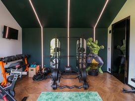 A home gym with fitness equipment at Manor Farm House in Merton near Bicester