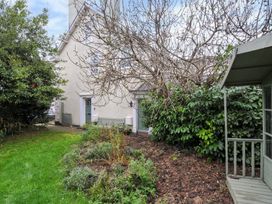 A house exterior with garden and trees at Violet's Rest in Exeter