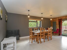 A dining room with a table and chairs at Willow Cottage Whiteparish
