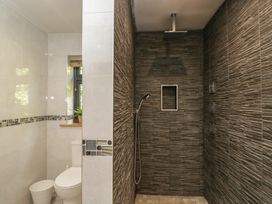 A bathroom with a shower and toilet at Willow Cottage in Whiteparish