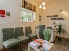 A nail salon with chairs and manicure station at Willow Cottage in Whiteparish