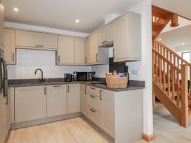 A kitchen with cabinets and countertop at Barn 2