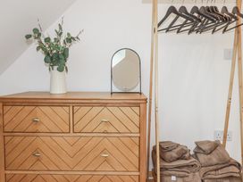 A dresser with a mirror and towels in a bedroom at Barn 2 