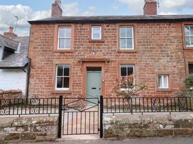 A house with a green door and a gate at Milford in Wetheral