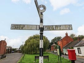 A signpost indicating directions to Cumwhitton, Cumrew and Warwick Bridge at Milford in Wetheral