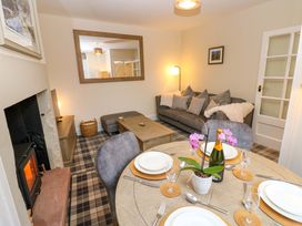 A dining room with a sofa and dining table at Milford in Great Corby, Wetheral