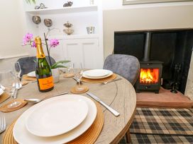 A dining room with a table set for a meal at Milford in Great Corby, Wetheral