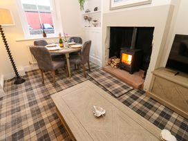 A dining room with a table and chairs at Milford in Great Corby, Wetheral