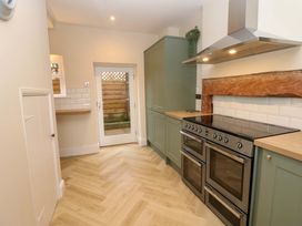 A kitchen with cabinets and an oven at Milford in Great Corby, Wetheral