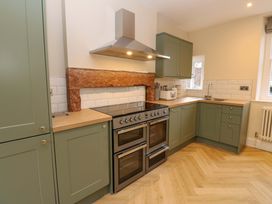 A kitchen with cabinets and an oven at Milford in Great Corby, Wetheral