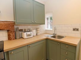 A kitchen with cabinets and appliances at Milford in Great Corby, Wetheral