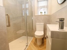 A bathroom with a shower and toilet at Milford in Great Corby, Wetheral