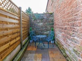 A garden with a table and chairs at Milford in Great Corby, Wetheral