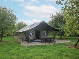 A tent with a table and chairs set outside at Hedgerow in Bewdley
