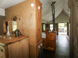 An indoor area with wooden furniture and a kitchen unit at Hedgerow in Bewdley
