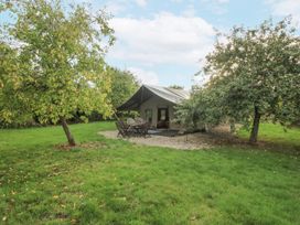 An outdoor area with a tent and seating at Hedgerow in Bewdley