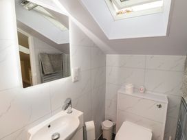 A bathroom with sink and toilet at Nobles Nook in Seahouses