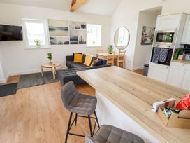 A living room with a sofa and coffee table at Lodge 12 South Hykeham