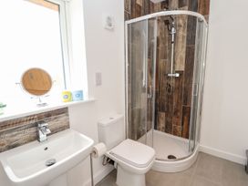 A bathroom with a shower, sink, and toilet at Lodge 12 in South Hykeham