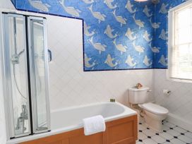 A bathroom with a bathtub and shower at The Mount in Chippenham