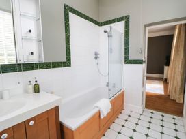 A bathroom with a bathtub and shower at The Mount in Chippenham