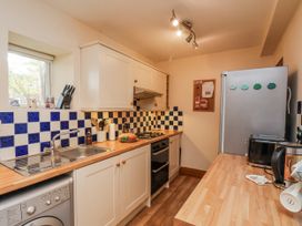A kitchen with appliances and utensils at 2 High Stakesby Cottages Whitby