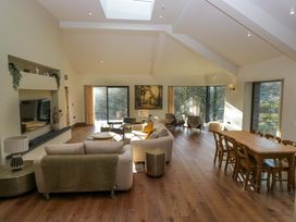 A living room with a sofa and dining table at The Old Bunkhouse in Grasmere