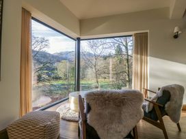 A living room with chairs and a table at The Old Bunkhouse in Grasmere