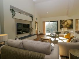 A living room with a sofa and television at The Old Bunkhouse in Grasmere