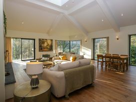 A living room with a sofa and dining table at The Old Bunkhouse in Grasmere