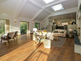 A living room with seating and table at The Old Bunkhouse in Grasmere