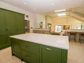 A kitchen with cabinets and a countertop at The Old Bunkhouse in Grasmere