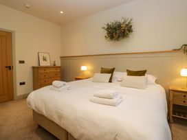 A bedroom with a bed and bedside tables at The Old Bunkhouse in Grasmere