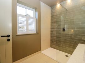 A bathroom with a shower and window at The Old Bunkhouse in Grasmere