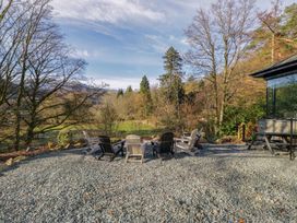 An outdoor seating area with chairs and a gravel surface at The Old Bunkhouse in Grasmere