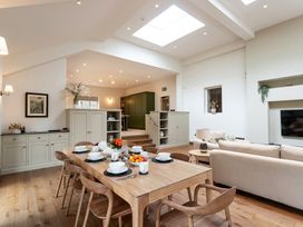 A living room with a dining table and sofa at The Old Bunkhouse in Grasmere