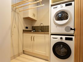 A laundry room with a washing machine and dryer at The Old Bunkhouse in Grasmere