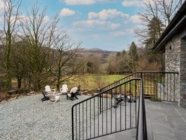 An outdoor seating area with gravel and chairs at The Old Bunkhouse in Grasmere