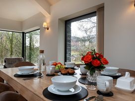 A dining room with a table set for a meal at The Old Bunkhouse in Grasmere