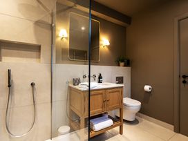 A bathroom with a sink and shower at The Old Bunkhouse in Grasmere