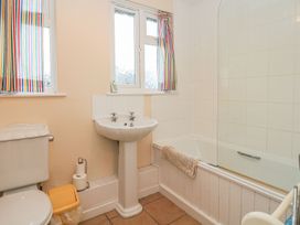A bathroom with a sink and toilet at Court House Farmhouse in Charmouth