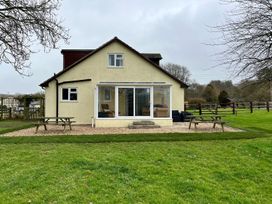 A house with patio and furniture at Court House Farmhouse in Charmouth