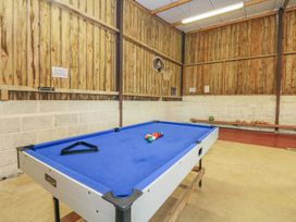 A game room featuring a pool table and basketball hoop at Court House Farmhouse in Charmouth