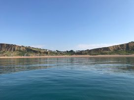 A view of cliffs and water at Court House Farmhouse in Charmouth