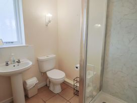 A bathroom with a sink and shower at Court House Farmhouse in Charmouth