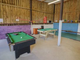 A games room with pool and snooker tables at Court House Farmhouse in Charmouth
