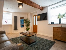A living room with a coffee table and sofa at Garn View in Dolgellau