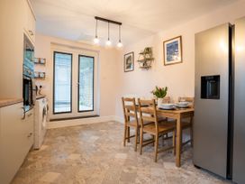 A kitchen with a table and chairs at Garn View in Dolgellau