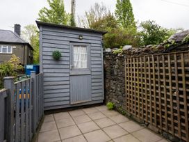 A shed with a door and window in an outdoor area at Garn View in Dolgellau